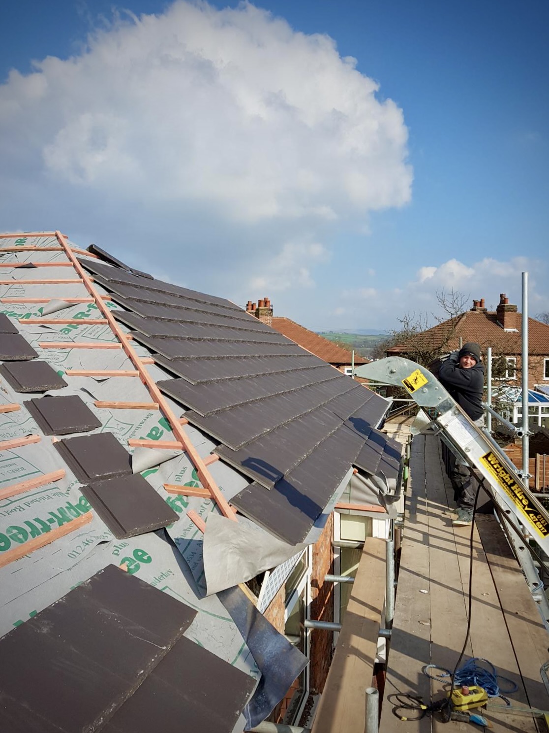 Example of nearly-completed roof tiling up to a gable